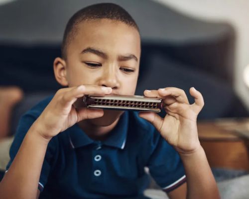 Harmonica playing by kid